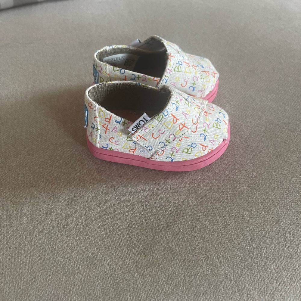 Infant girls TOMS shoes size 2